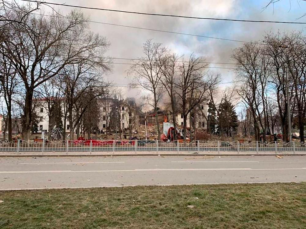 March 16, 2022, shows the Drama Theatre destroyed by shelling in Mariupol. Ukraine accused Russia on March 17, 2022 of bombing a theatre that was sheltering more than 1,000 civilians in the city of Mariupol, after US President Joe Biden branded Vladimir Putin a “war criminal”. AFPPIX