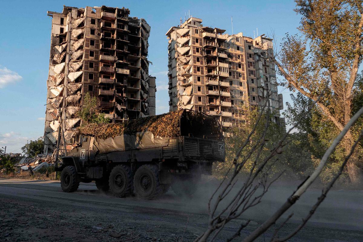 A military truck drives past destroyed residential buildings in Avdiivka, a Russian-controled Donetsk region of Ukraine on September 27, 2025, amid the ongoing Russian-Ukrainian conflict. - AFPPIX