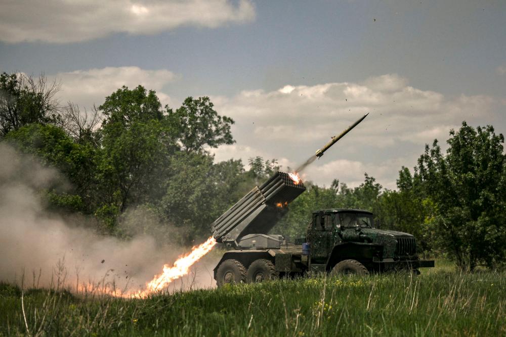 Ukrainian troops fire with surface-to-surface rockets MLRS towards Russian positions at a front line in the eastern Ukrainian region of Donbas on June 7, 2022. AFPPIX