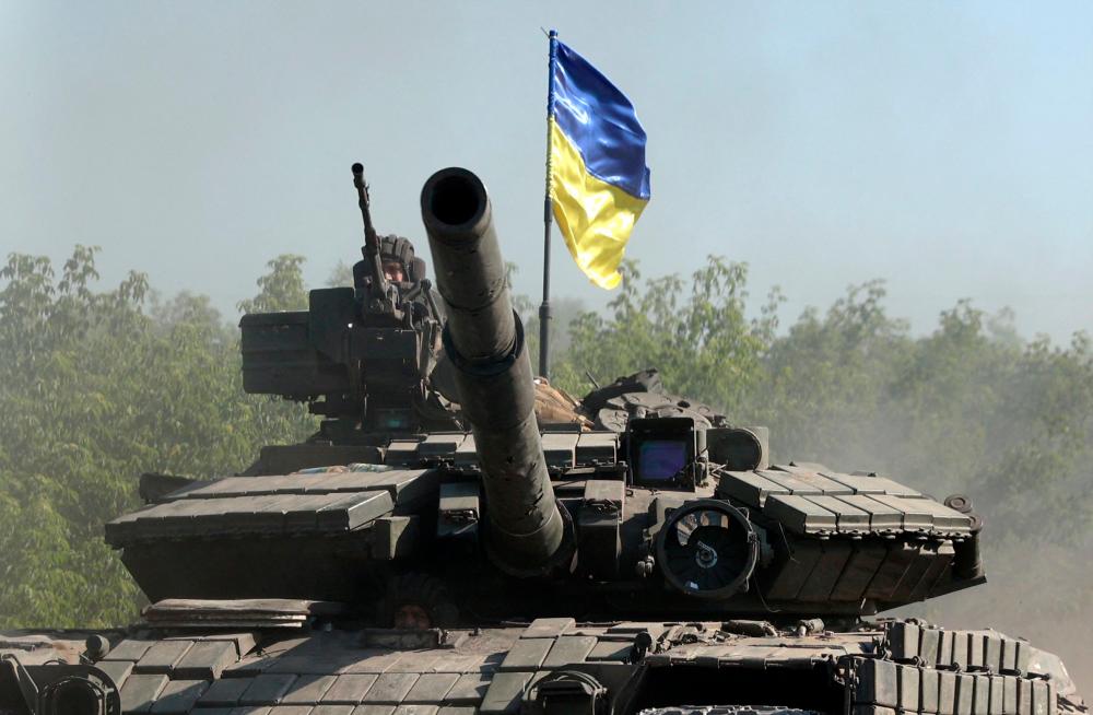 Ukrainian troop ride a tank on a road of the eastern Ukrainian region of Donbas on June 21, 2022, as Ukraine says Russian shelling has caused “catastrophic destruction” in the eastern industrial city of Lysychansk, which lies just across a river from Severodonetsk where Russian and Ukrainian troops have been locked in battle for weeks. AFPPIX