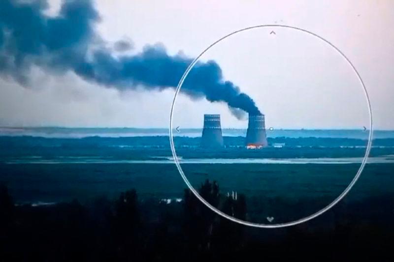 This video grab taken from a handout footage released by the Ukrainian Presidential Press Service on August 11, 2024, shows a fire at a cooling tower of the Russian-controlled Zaporizhzhia nuclear power plant in Energodar - AFPpix