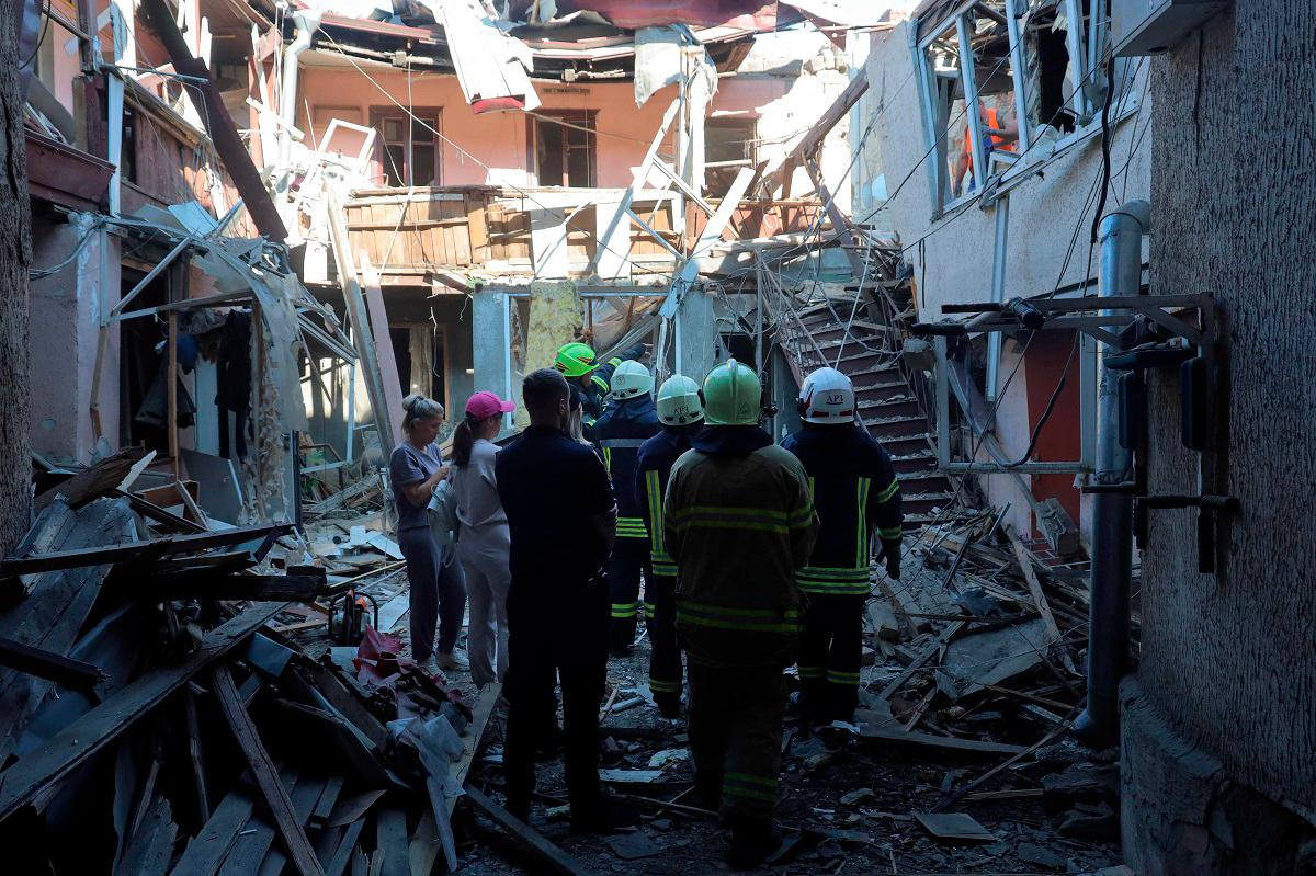Ukrainian rescuers inspect the site of a drone attack in the port city of Odesa on June 17, 2025, amid the Russian invasion in Ukraine. Ukraine on June 17 slammed the lack of an “adequate reaction” from the world to Russia’s deadly strikes on its soil, after an attack on the capital Kyiv killed at least 14 people. - Oleksandr GIMANOV / AFP