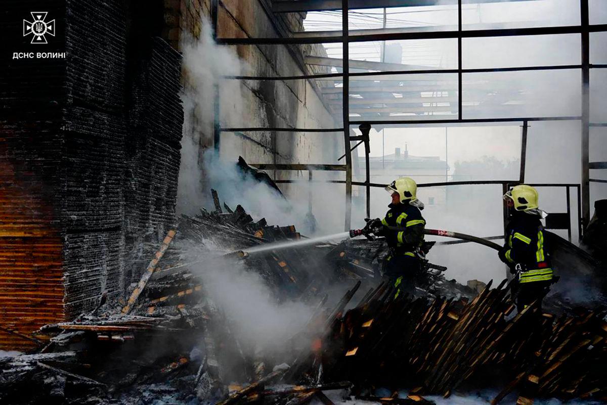 Firefighters extinguishing a fire after Russian shelling in Lutsk, amid the Russian invasion of Ukraine. (Photo by Handout / UKRAINIAN STATE EMERGENCY SERVICE / AFP)
