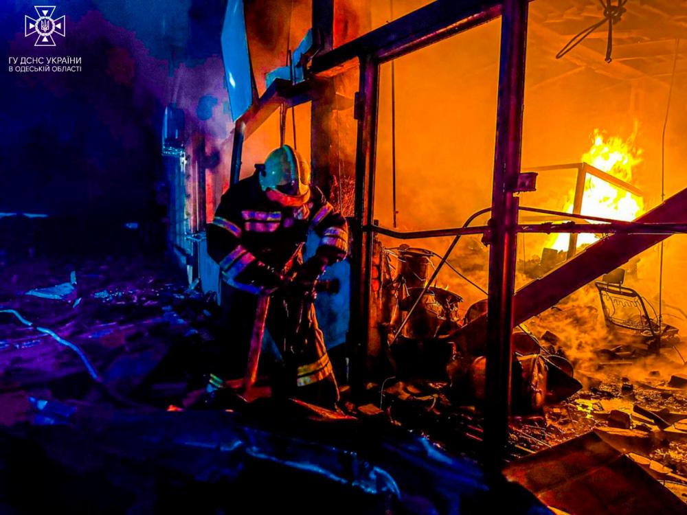 This photograph taken on November 5, 2023 and released on November 6, 2023 by Ukrainian Emergency Service shows firefighters working to extinguish a fire in a building following a late strike in Odesa, amid the Russian invasion of Ukraine/AFPPix