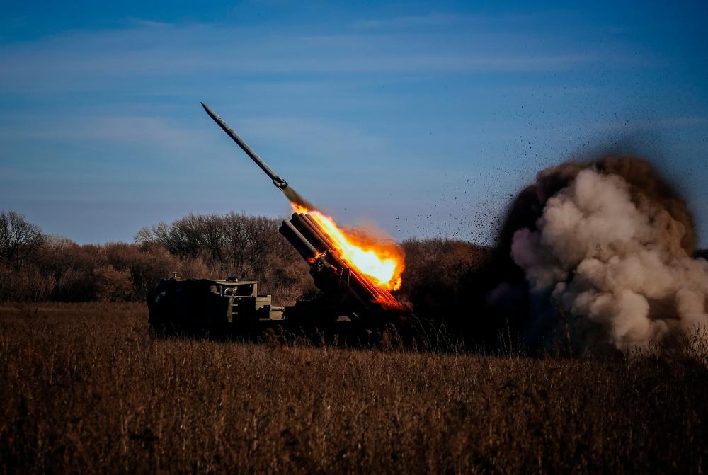A self-propelled 220 mm multiple rocket launcher “Bureviy” fires towards Russian positions on the front line, eastern Ukraine on November 29, 2022, amid the Russian invasion of Ukraine. AFPPIX