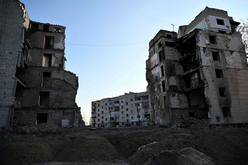 This photograph taken in Borodyanka, Kyiv region, on November 7, 2024, shows destroyed residential buildings, amid the Russian invasion of Ukraine. Spanish traveller Alberto Blasco Ventas looked out at Ukraine’s destroyed Irpin brige, blown up to stop Russian troops in 2022 and now a hotspot for thrill-seeking tourists visiting the country. - Genya SAVILOV / AFP