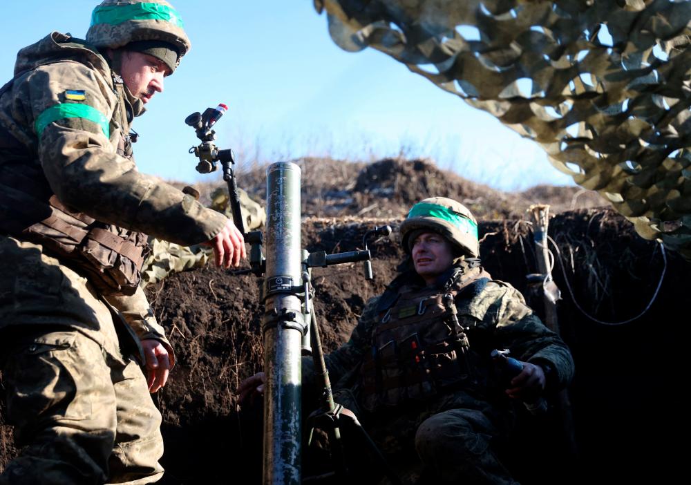 Ukrainian servicemen fire with mortars from their position not far from Bakhmut, Donetsk region on January 27, 2023, amid Russian invasion of Ukraine. AFPPIX