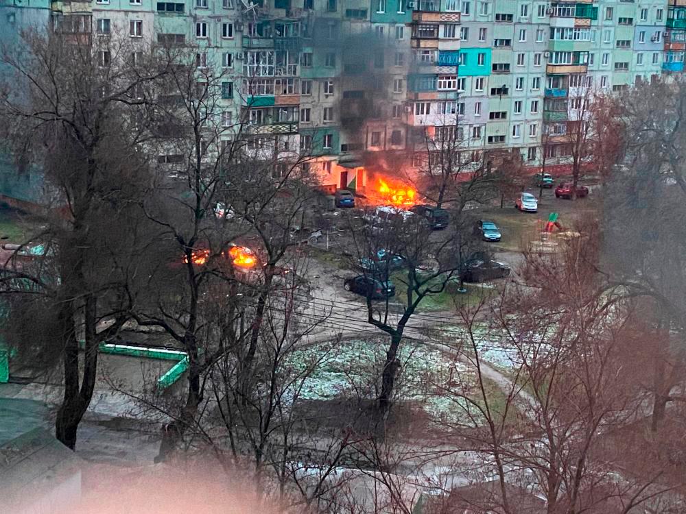 Fire is seen in Mariupol after Russia launched a massive military operation against Ukraine March 3, 2022, in this image obtained from social media by REUTERSpix