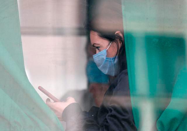 A passenger wearing a protective face mask is seen in a bus amid the coronavirus disease (Covid-19) in central Kyiv, Ukraine September 28, 2020. — Reuters