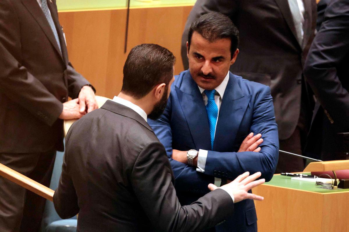 Syrian President Ahmed al-Sharaa (L) chats with Qatar's Emir Sheikh Tamim bin Hamad Al Thani (R) as they attend a United Nations Summit on Palestinians at UN headquarters during the United Nations General Assembly (UNGA) in New York on September 22, 2025. - AFPPIX