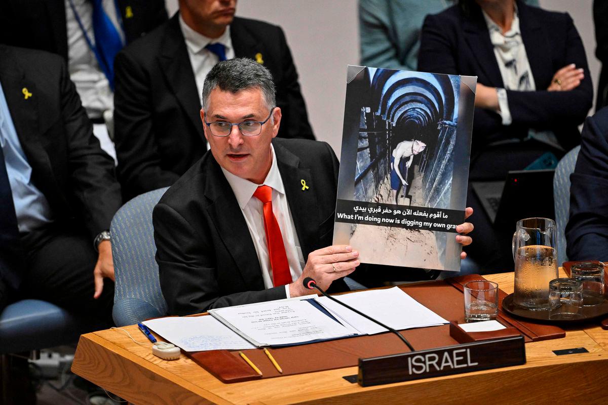 Israel’s Foreign Minister Gideon Sa’ar holds up an image of hostage Evyatar David during a United Nations Security Council meeting on the conflict in the Middle East, including the Palestinian question, at United Nations headquarters. AFPPix