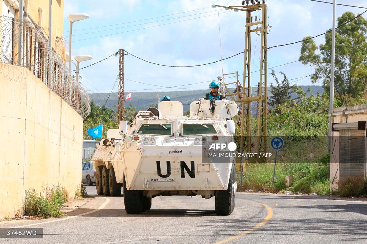 Members of the United Nations peacekeeping force in Lebanon (UNIFIL) patrol the road near the border with Israel in the southern Lebanese coastal town of Naqura on March 19, 2025. - Mahmoud ZAYYAT / AFP)