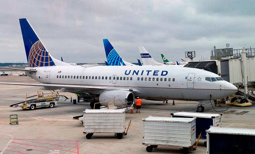 A United Airlines plane is seen at a gate at George Bush Intercontinental Airport in Houston, Texas, in October, 2020. The latest contract brings United's total order book on the MAX to 188. – AFPPIX