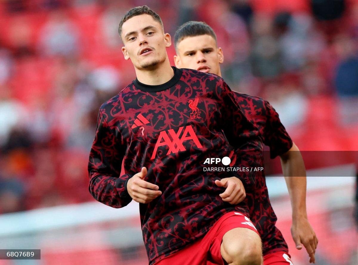 Liverpool’s German midfielder #07 Florian Wirtz (L) and Liverpool’s Hungarian defender #06 Milos Kerkez warm up ahead of the second of two pre season friendly football matches between Liverpool and Athletic Bilbao at Anfield in Liverpool, north west England on August 4, 2025. - AFP