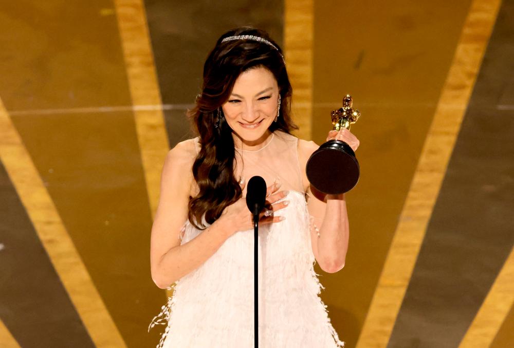 HOLLYWOOD, CALIFORNIA - MARCH 12: Michelle Yeoh accepts the Best Actress award for “Everything Everywhere All at Once” onstage during the 95th Annual Academy Awards at Dolby Theatre on March 12, 2023 in Hollywood, California. AFPPIX