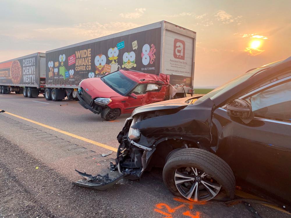 In this photo taken by the Utah Highway Patrol on July 25, 2021, cars and trucks are seen after an accident on Interstae 15 in Millard County, Utah. -AFP