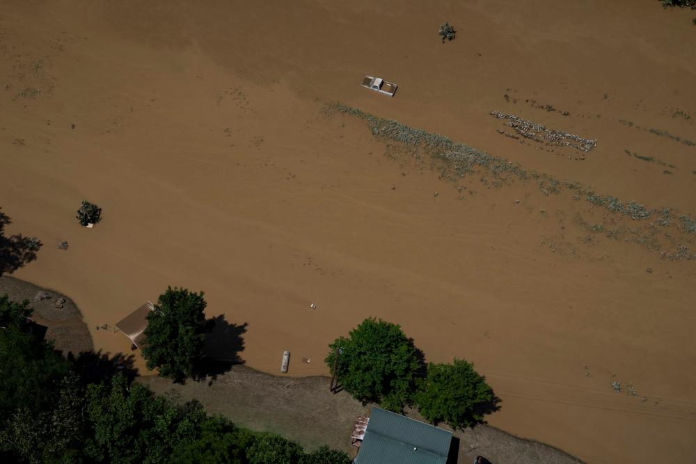 In this aerial view, floodwater can be seen as the Kentucky National Guard fly a recon and rescue mission on July 30, 2022 in Breathitt County near Jackson, Kentucky/AFPPix