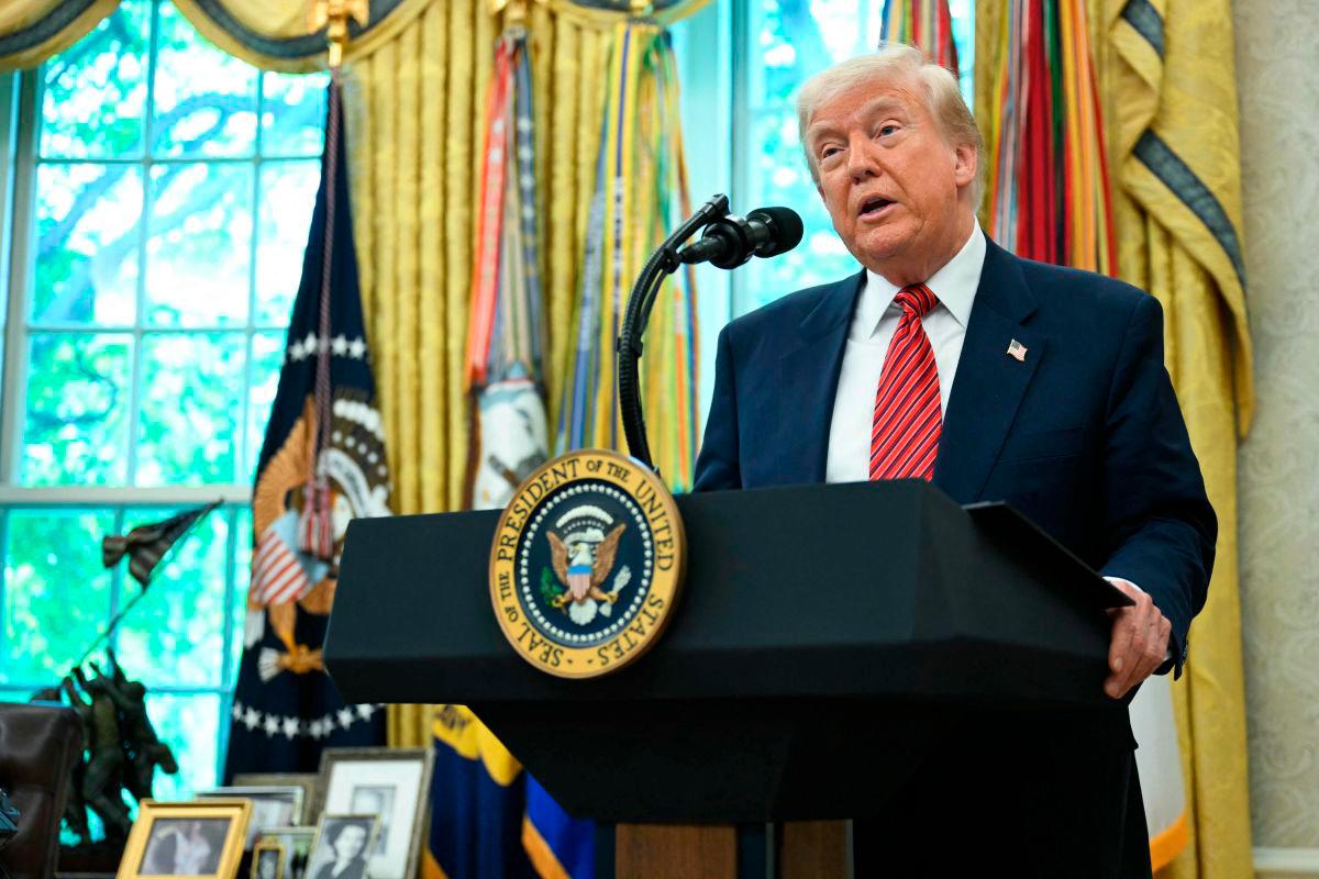 US President Donald Trump speaks during a swearing-in ceremony for the Ambassador to China, former Republican Senator of Georgia, David Perdue, in the Oval Office of the White House in Washington, DC, May 7, 2025. AFPpix