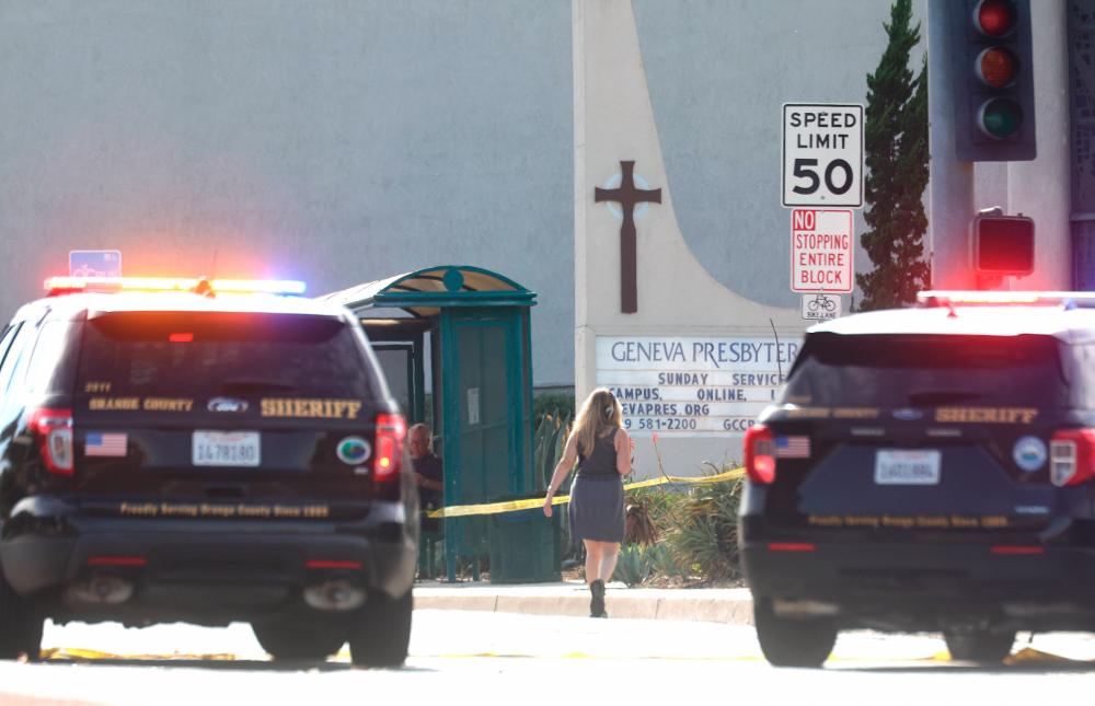 Police vehicles are parked near the scene of a shooting at the Geneva Presbyterian Church on May 15, 2022 in Laguna Woods, California. AFPPIX