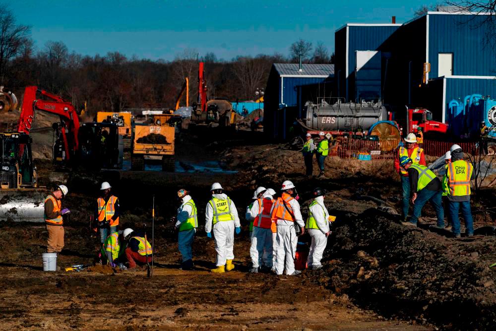 Ohio EPA and EPA contractors collect soil and air samples from the derailment site on March 9, 2023 in East Palestine, Ohio. AFPPIX