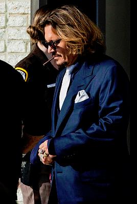 US actor Johnny Depp leaves the Fairfax County Circuit Court after the first day in the lawsuit between him and his former wife, US actress Amber Heard, in Fairfax, Virginia. - AFPPIX