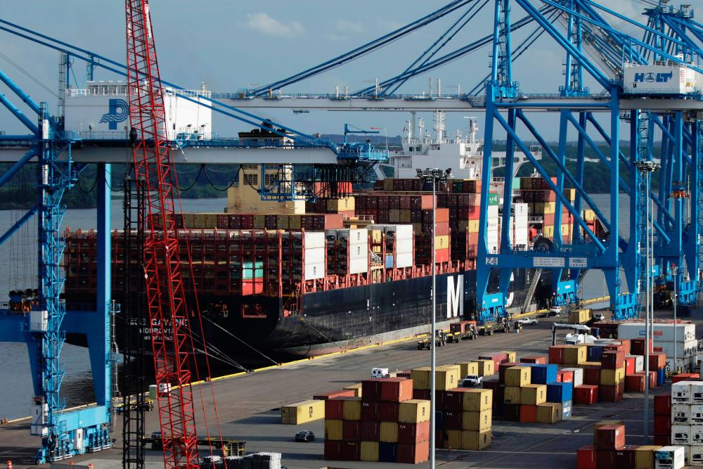 Cranes unload the freight ship MSC Gayane, after US authorities seized more than 16 tons of cocaine at the Packer Marine Terminal in Philadelphia, Pennsylvania on June 18, 2019. — AFP