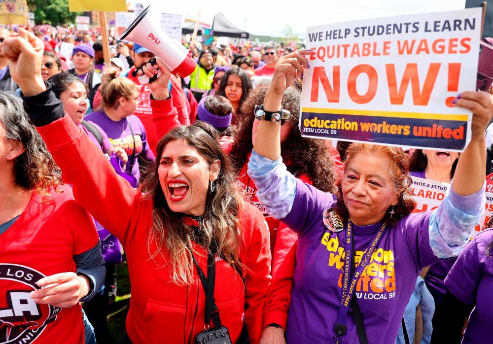 LOS ANGELES, CALIFORNIA - MARCH 23: Los Angeles Unified School District (LAUSD) workers and supporters rally in Los Angeles State Historic Park on the last day of a strike over a new contract on March 23, 2023 in Los Angeles, California. AFPPIX