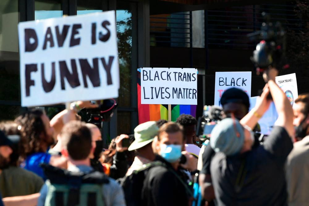 People rally in support of the Netflix transgender walkout and others in support of comedy and free speech, on October 20, 2021 in Los Angeles, California. AFPpix