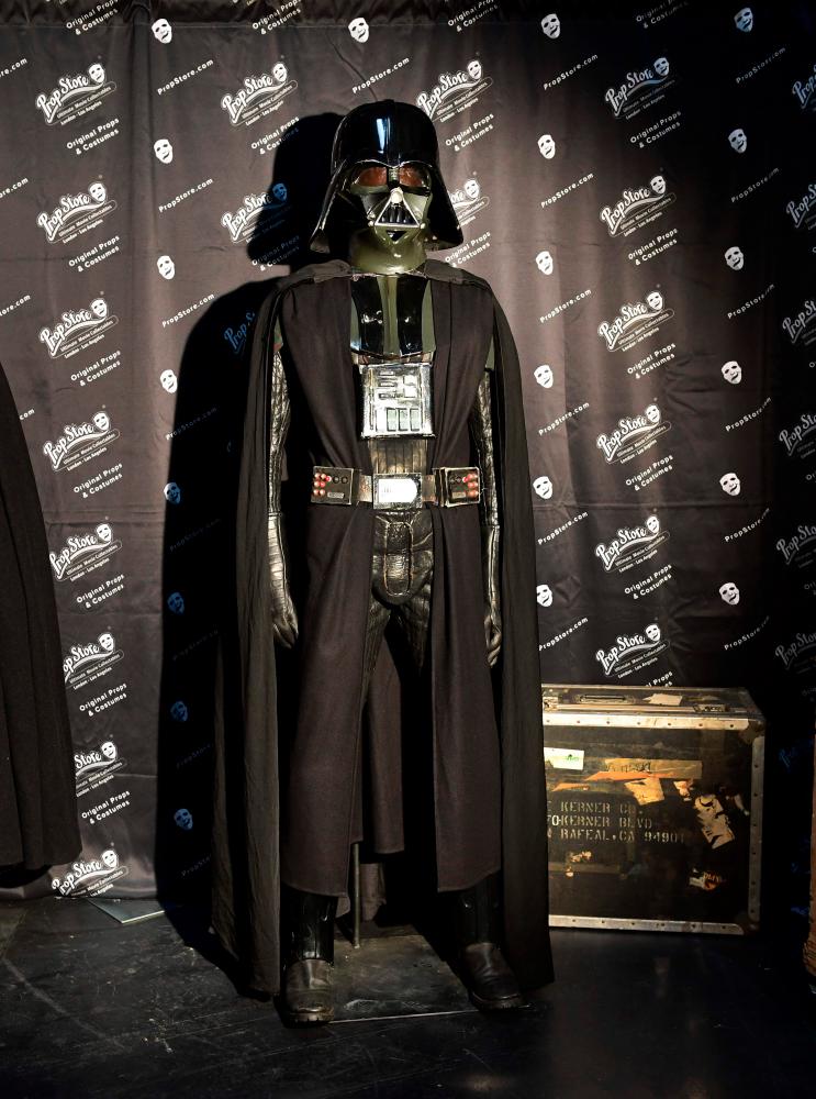 Items up for auction at the Prop Store Auction in late August are on display at the Prop Store in Valencia, California on July 15, 2020 including Darth Vader’s helmet and costume from the movie “Star Wars” estimated at $150,000-250,000 USD. / AFP / Frederic J. BROWN / TO GO WITH AFP STORY by Ben SHEPPARD