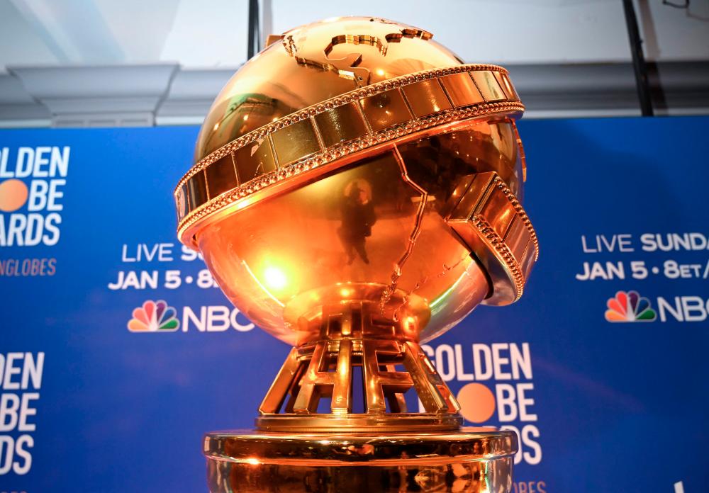 (FILES) In this file photo taken on December 09, 2019 Giant Golden Globe trophy are set on stage ahead of the 77th Annual Golden Globe Awards nominations announcement at the Beverly Hilton hotel in Beverly Hills. - AFP