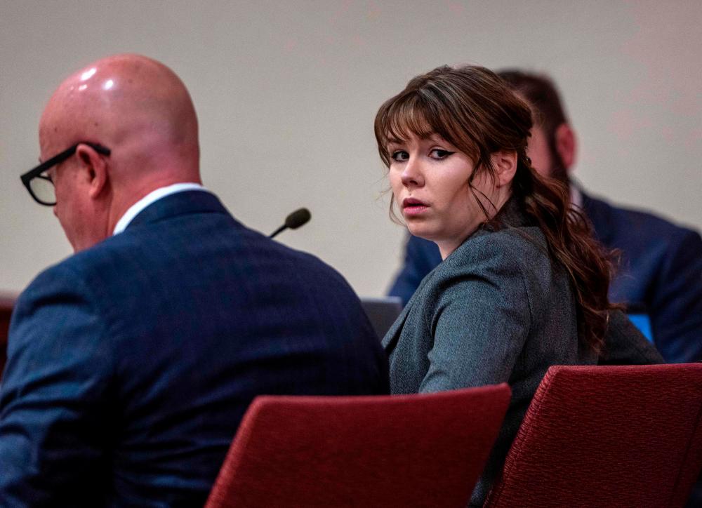 Armorer Hannah Gutierrez-Reed (R) sits in court with her attorney Jason Bowles (L) during the first day of her trial at First District Court, in Santa Fe, New Mexico, on February 22, 2024/AFPPix