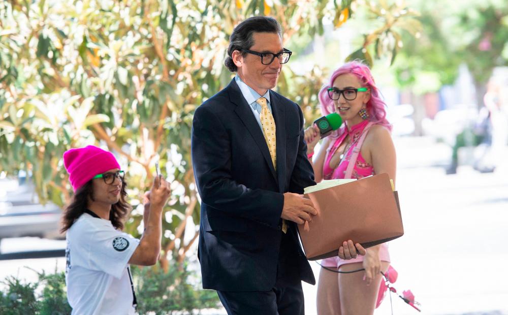 Britney Spears’ new layer Mathew S. Rosengart walks by the fans and supporters of Britney Spears as he arrives to the Los Angeles County Courthouse for a scheduled hearing in the Britney Spears guardianship case, in Los Angeles, July 19, 2021.-AFP