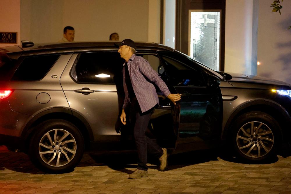 Former Brazilian far-right President Jair Bolsonaro (in the backseat not seen) arrives in a vehicle at his rental home in the gated community of Encore Resort at Reunion after being released from the hospital on January 10, 2023 in Kissimmee, Florida/AFPPix