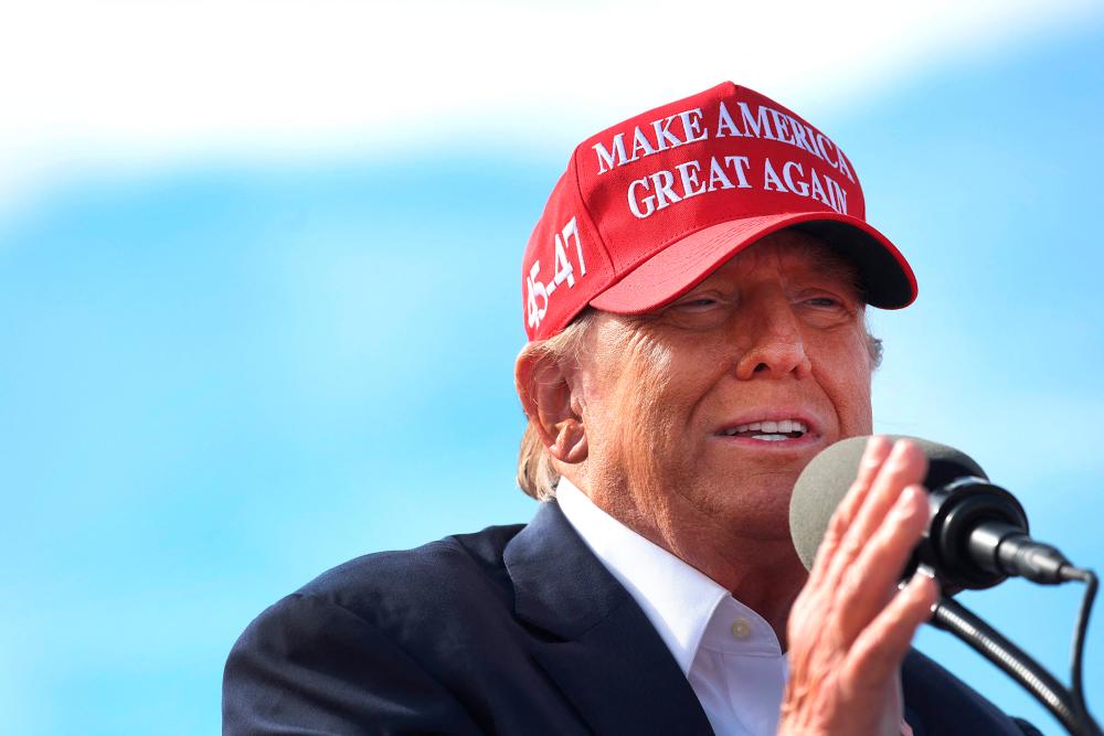 Republican presidential candidate former President Donald Trump speaks to supporters during a rally at the Dayton International Airport on March 16, 2024 in Vandalia, Ohio/AFPPix
