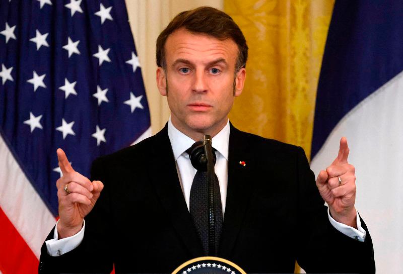 French President Emmanuel Macron speaks during a joint press conference with US President Donald Trump in the East Room to the White House in Washington, DC, on February 24, 2025. - Ludovic MARIN / AFP