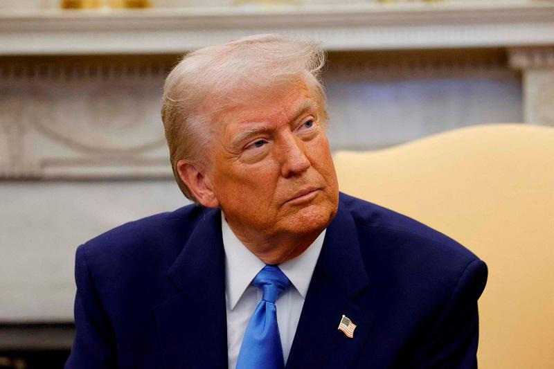 US President Donald Trump meets with French President Emmanuel Macron (out of frame) in the Oval Office of the White House in Washington, DC, on February 24, 2025. - Ludovic MARIN / POOL / AFP