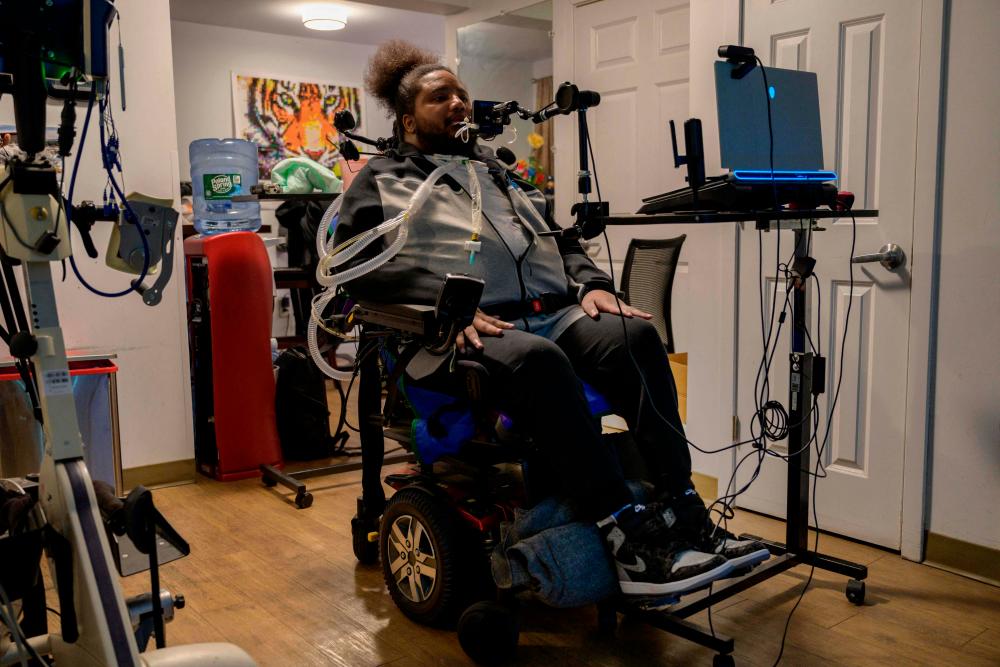 Gun violence survivor Ralph Norman, who was shot at 17 years old and left quadriplegic, attends a zoom meeting in his apartment in Yonkers, New York, on March 3, 2023. AFPPIX