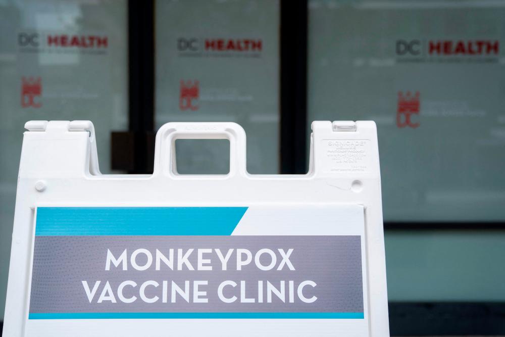 This photo taken on August 5, 2022 shows a sign for a Monkeypox vaccine clinic in Washington, DC. US President Joe Biden’s government on August 4 declared monkeypox a public health emergency, a move that should free up new funds, assist in data gathering and allow the deployment of additional personnel in the fight against the disease/AFPPix