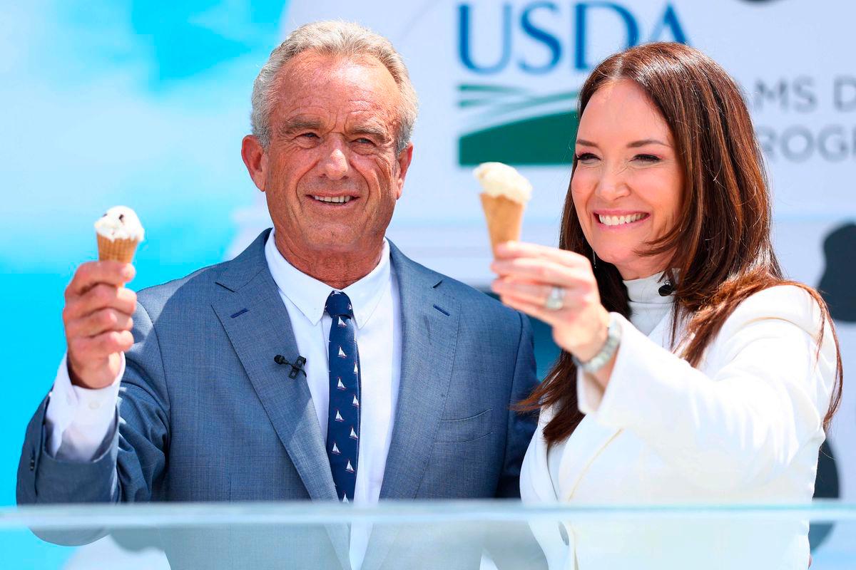 Health and Human Services (HHS) Secretary Robert F. Kennedy Jr. and U.S. Secretary of Agriculture Brooke L. Rollins hold up ice cream cones - Michael M. Santiago/Getty Images/AFPPix
