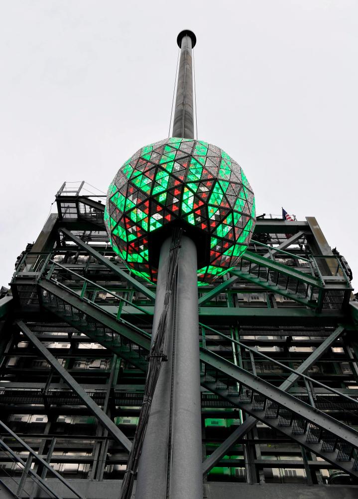 The world famous Times Square crystal ball is illuminated and elevated for a final test, a day ahead of the New Year’s Eve celebrations at Time Square, on December 30, 2020 in New York City. AFP / Angela Weiss