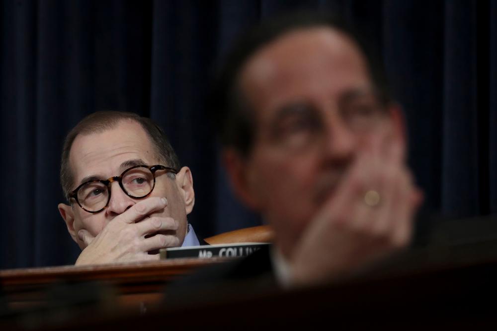 (L-R) House Judiciary Committee Chairman Jerry Nadler (D-NY) and Rep. Jamie Raskin listen to opening statements during a committee markup hearing on the articles of impeachment against US President Donald Trump in the Longworth House Office Building on Capitol Hill on Dec 11, in Washington, DC. — AFP