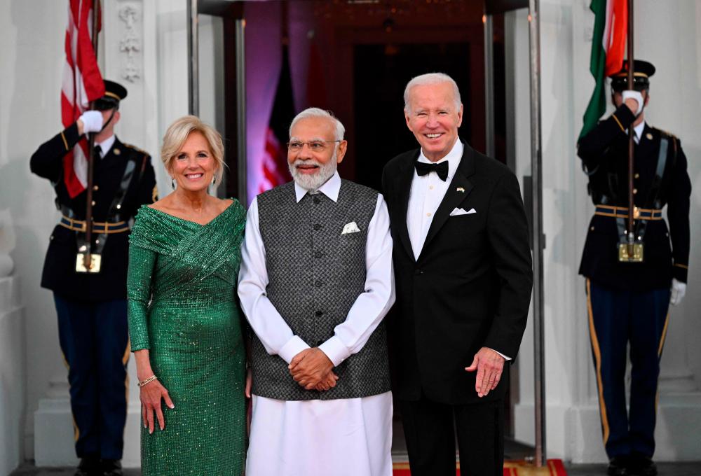 US President Joe Biden and First Lady Jill Biden greet India’s Prime Minister Narendra Modi on arrival for a State Dinner at the North Portico of the White House in Washington, DC, on June 22, 2023. AFPPIX