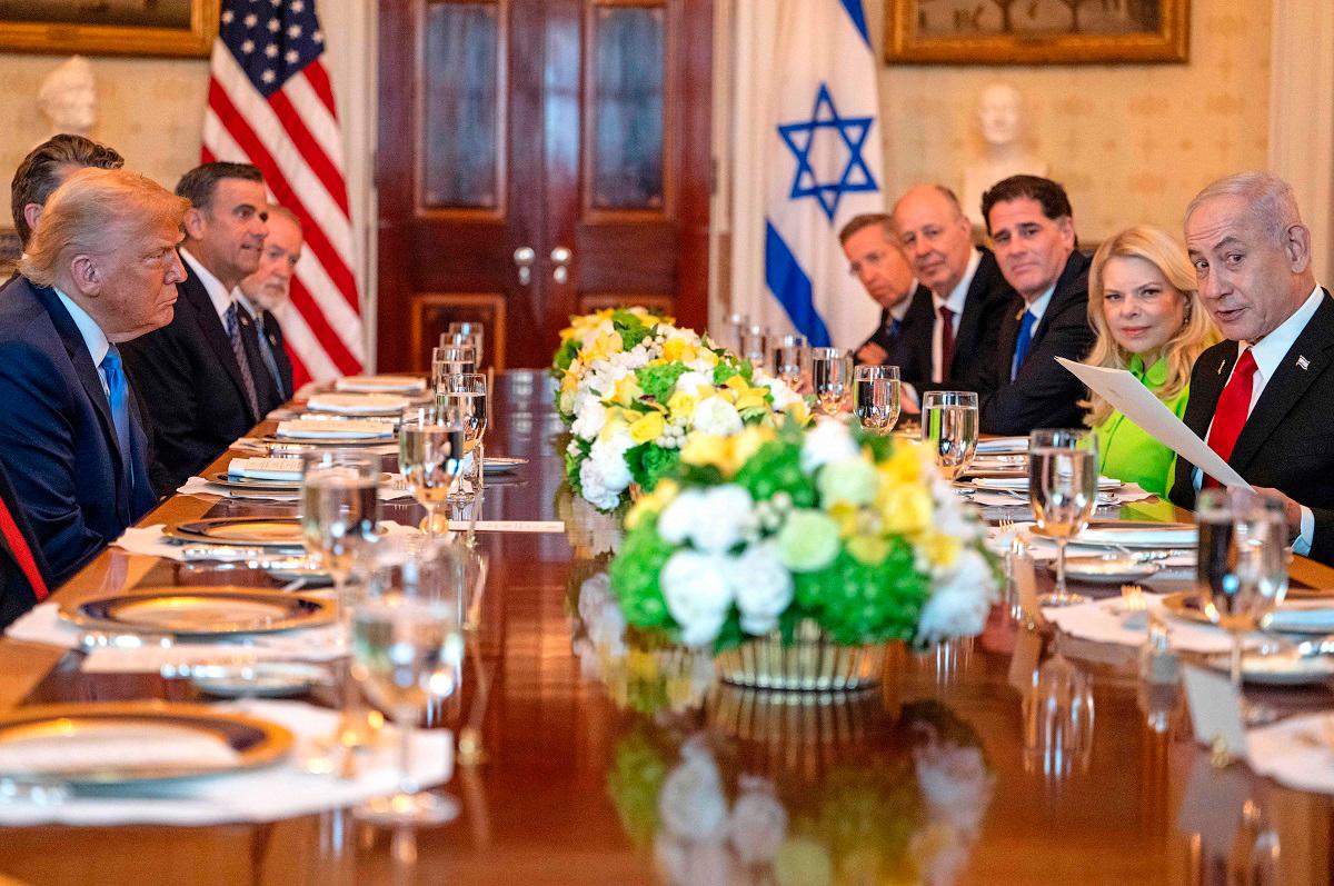 US President Donald Trump meets with Israeli Prime Minister Benjamin Netanyahu at the Blue Room of the White House in Washington, DC, on July 7, 2025. - ANDREW CABALLERO-REYNOLDS / AFP