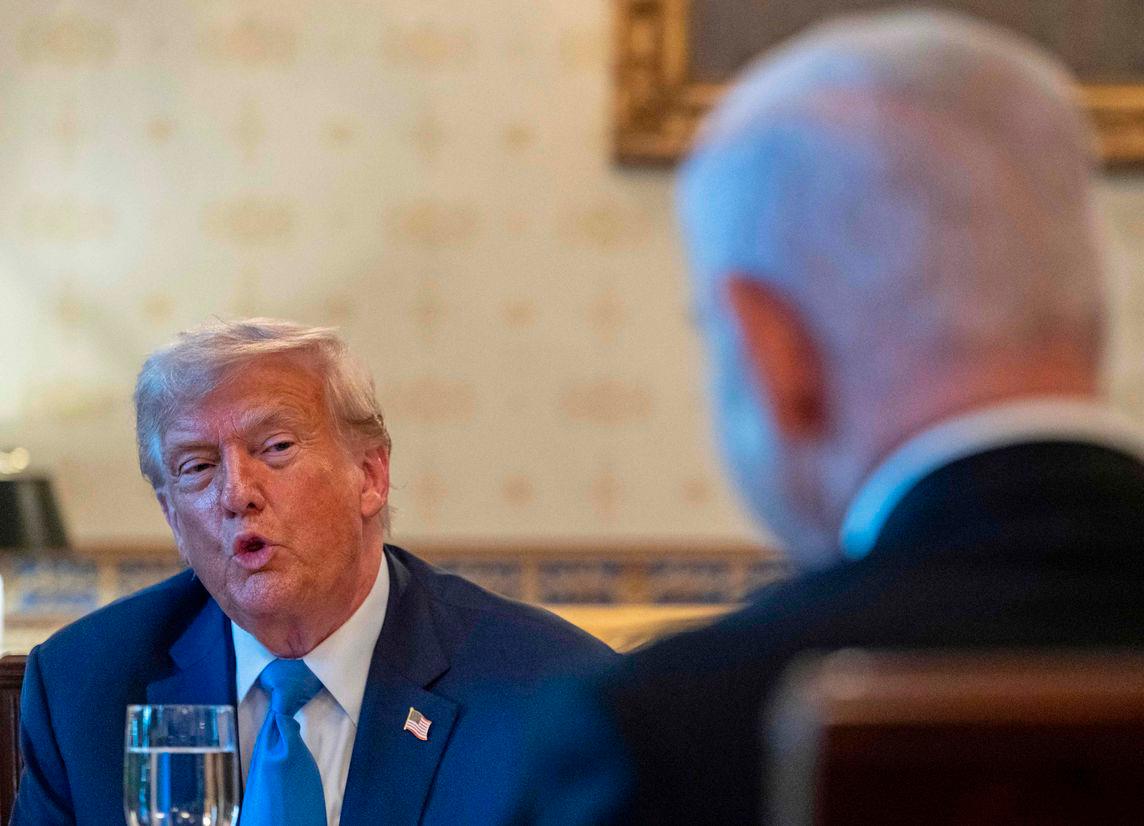 US President Donald Trump meets with Israeli Prime Minister Benjamin Netanyahu (R) at the Blue Room of the White House in Washington, DC, on July 7, 2025. (Photo by ANDREW CABALLERO-REYNOLDS / AFP)