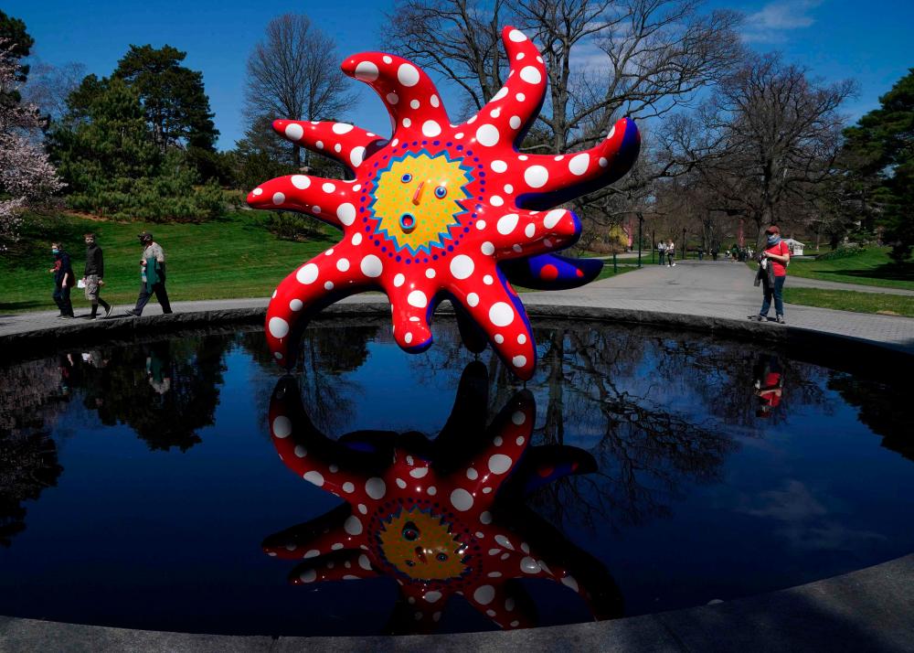 Japanese artist Yayoi Kusama's I Want to Fly to the Universe on display during the KUSAMA: Cosmic Nature Media Preview on April 7, 2021 at the New York Botanical Garden in the Bronx borough of New York City. –AFP