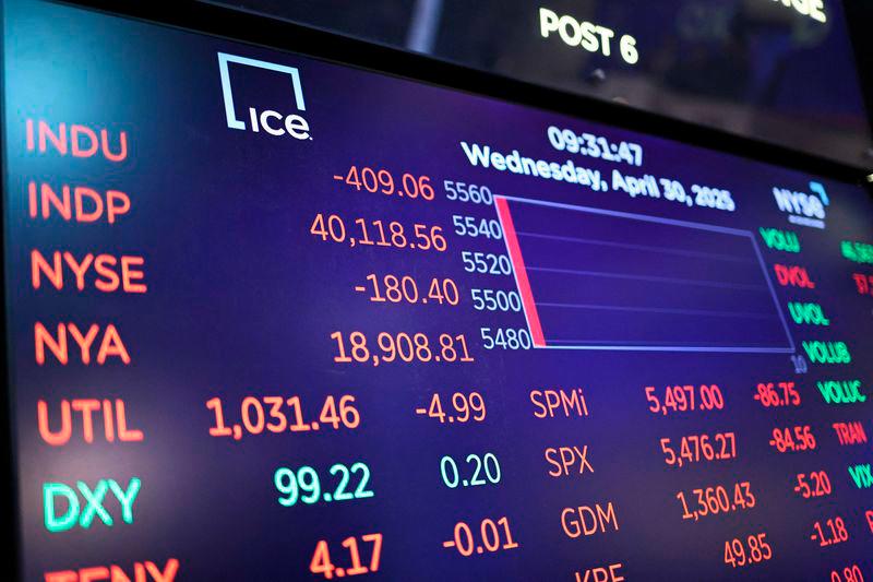 Stock market numbers are displayed on the floor of the New York Stock Exchange