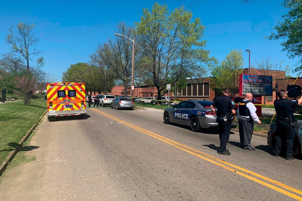 This handout image released by the Knoxville Police Department on April 12, 2021, shows multiple agencies personnel at the scene of a shooting at Austin-East Magnet High School, in Knoxville, Tennessee. –AFP