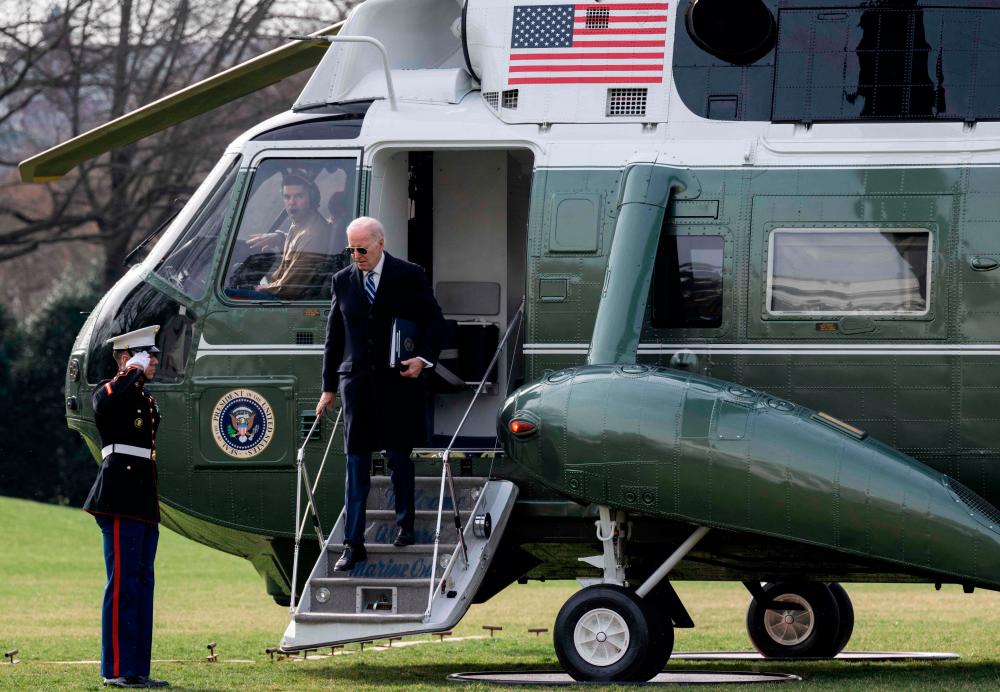 US President Joe Biden disembarks from Marine One after arriving on the South Lawn of the White House in Washington, DC, on February 27, 2023 following a weekend at his home in Wilmington, Delaware. AFPPIX