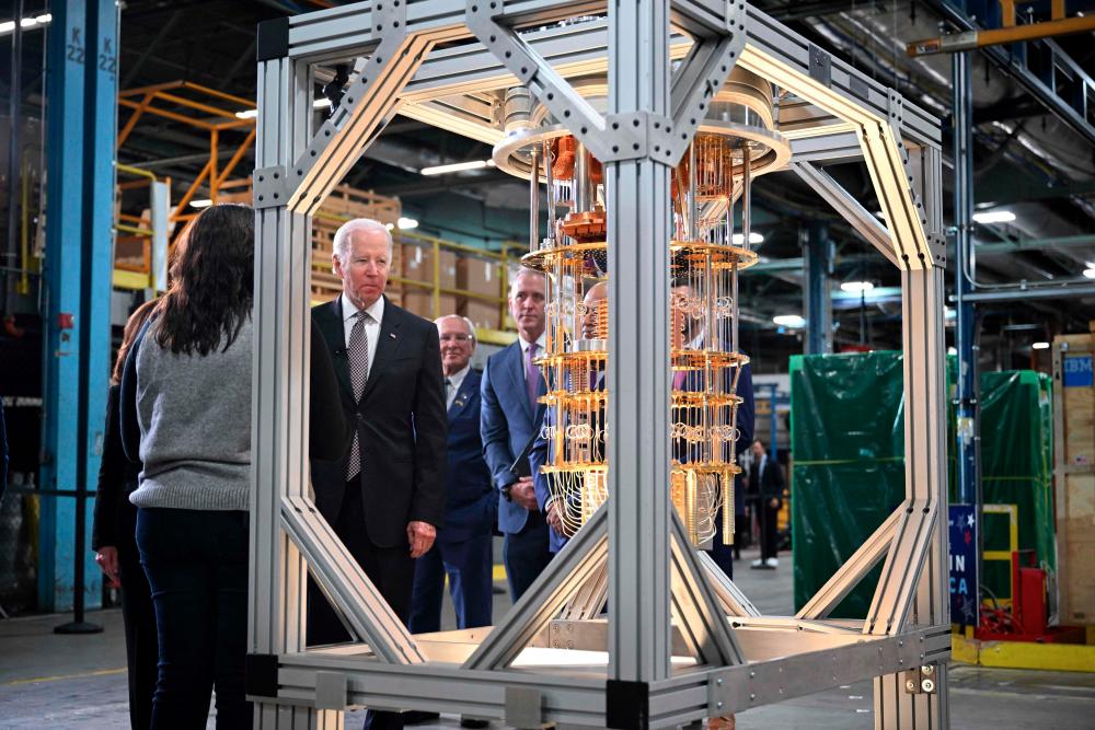 Biden looking at a quantum computer as he tours the IBM facility in Poughkeepsie, New York, on Thursday, Oct. 6. – AFPpic