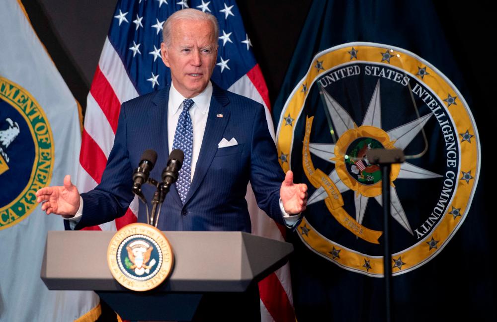 US President Joe Biden addresses the Intelligence Community workforce and its leadership while on a tour at the Office of the Director of National Intelligence in McLean, Virginia, on July 27, 2021. -AFP
